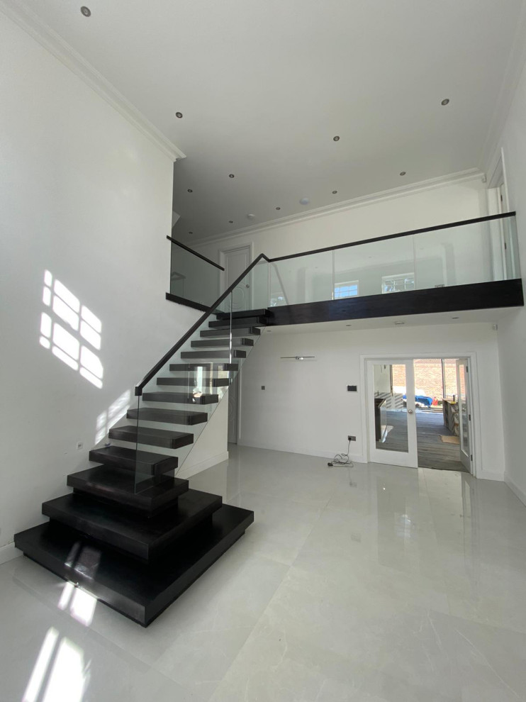 Design ideas for a medium sized modern staircase in Hertfordshire.