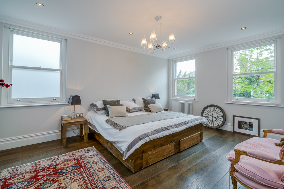 This is an example of a transitional bedroom in Surrey.