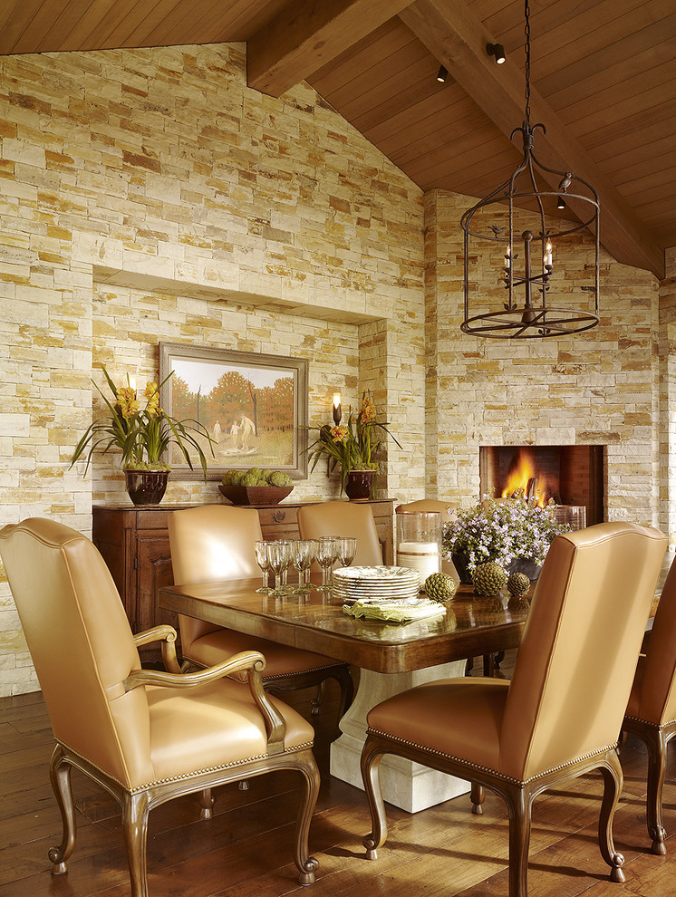 Design ideas for a mediterranean dining room in San Francisco with medium hardwood floors and a corner fireplace.