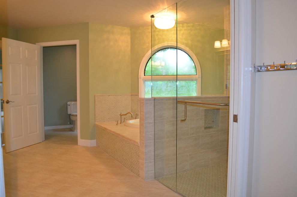 Design ideas for a large transitional master bathroom in Jacksonville with engineered quartz benchtops, a drop-in tub, beige tile, glass tile, green walls and porcelain floors.