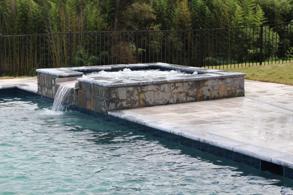 Small mountain style backyard stone and rectangular natural hot tub photo in DC Metro