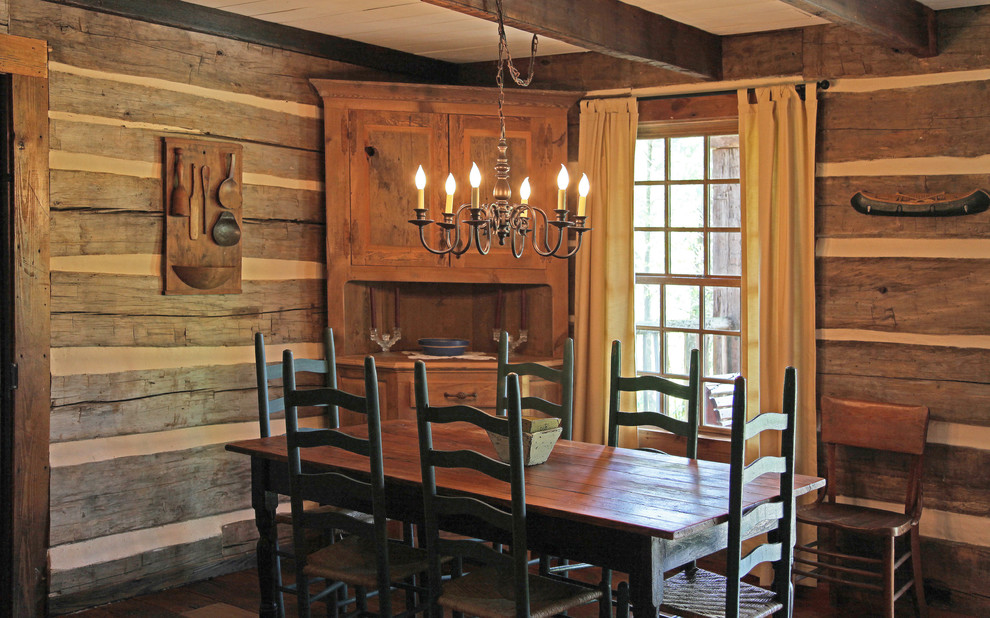 Inspiration for a mid-sized country kitchen/dining combo in Other with brown walls and medium hardwood floors.