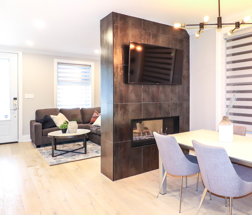 Inspiration for a small transitional l-shaped light wood floor and beige floor eat-in kitchen remodel in Toronto with an undermount sink, shaker cabinets, white cabinets, quartzite countertops, white backsplash, ceramic backsplash, stainless steel appliances, an island and white countertops