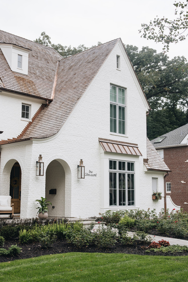 ASC Margaritaville - Large transitional white three-story painted brick house exterior photo in Chicago with a shingle roof and a brown roof