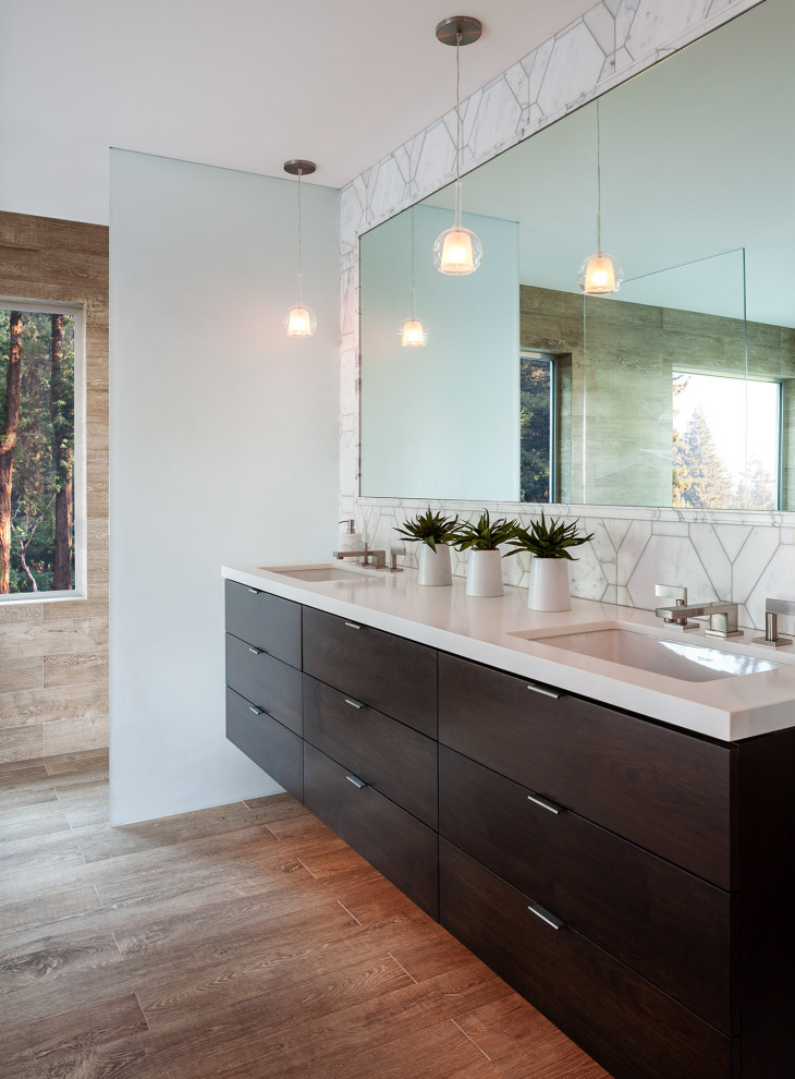 Large midcentury master wet room bathroom in San Francisco with flat-panel cabinets, dark wood cabinets, a freestanding tub, marble, medium hardwood floors, an undermount sink, brown floor, an open shower, gray tile, white tile, brown walls, quartzite benchtops and white benchtops.