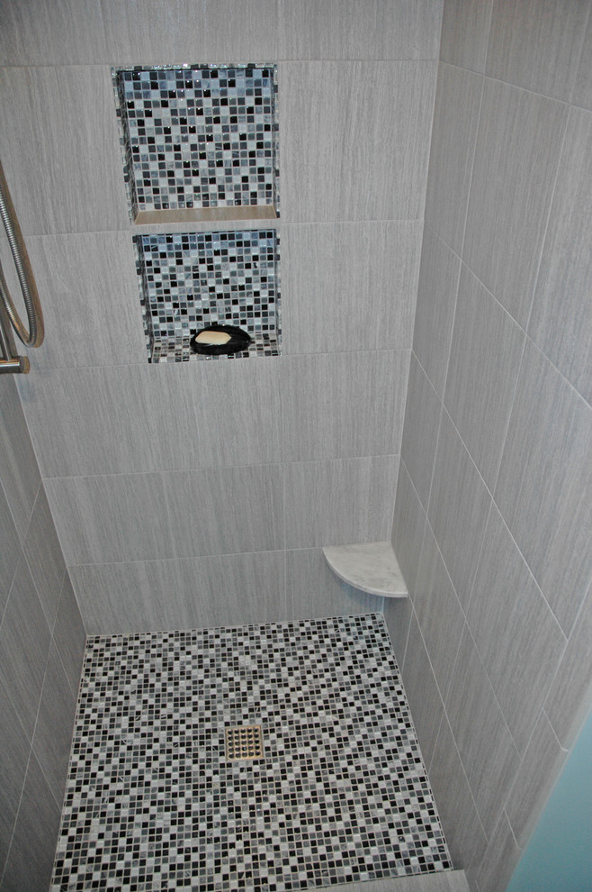 Alcove bathtub - mid-sized transitional master white tile and subway tile porcelain tile and gray floor alcove bathtub idea with shaker cabinets, white cabinets, a two-piece toilet, blue walls, an undermount sink, marble countertops and white countertops
