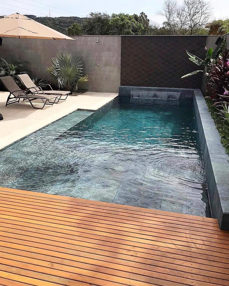 This is an example of a large modern backyard rectangular lap pool in San Francisco.
