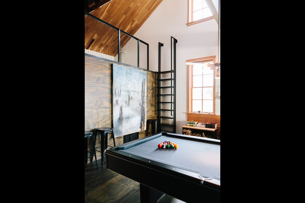 Design ideas for a large industrial loft-style family room in Portland with a game room, white walls and plywood floors.
