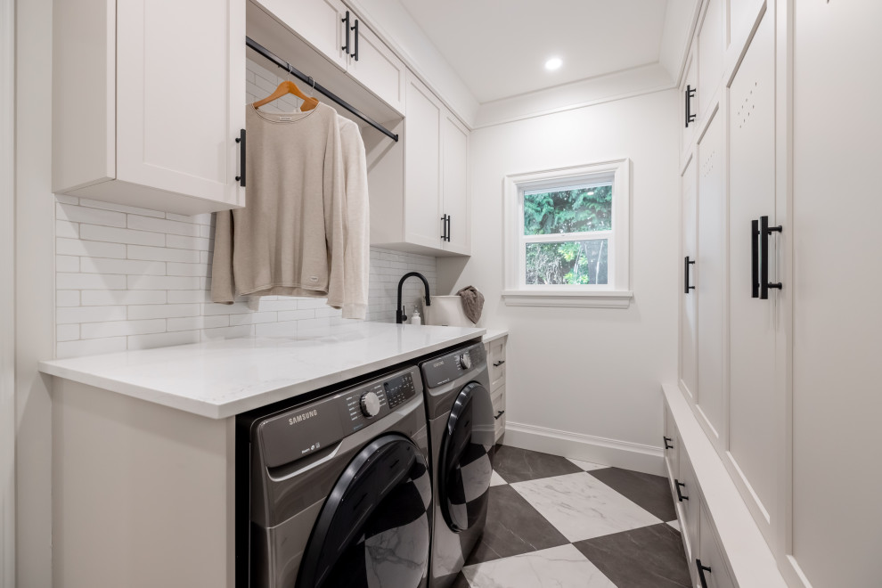 This is an example of a transitional laundry room in Vancouver.