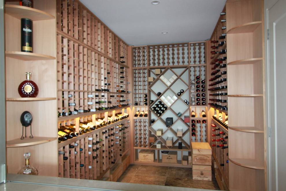 Small traditional wine cellar in Sydney with travertine floors.