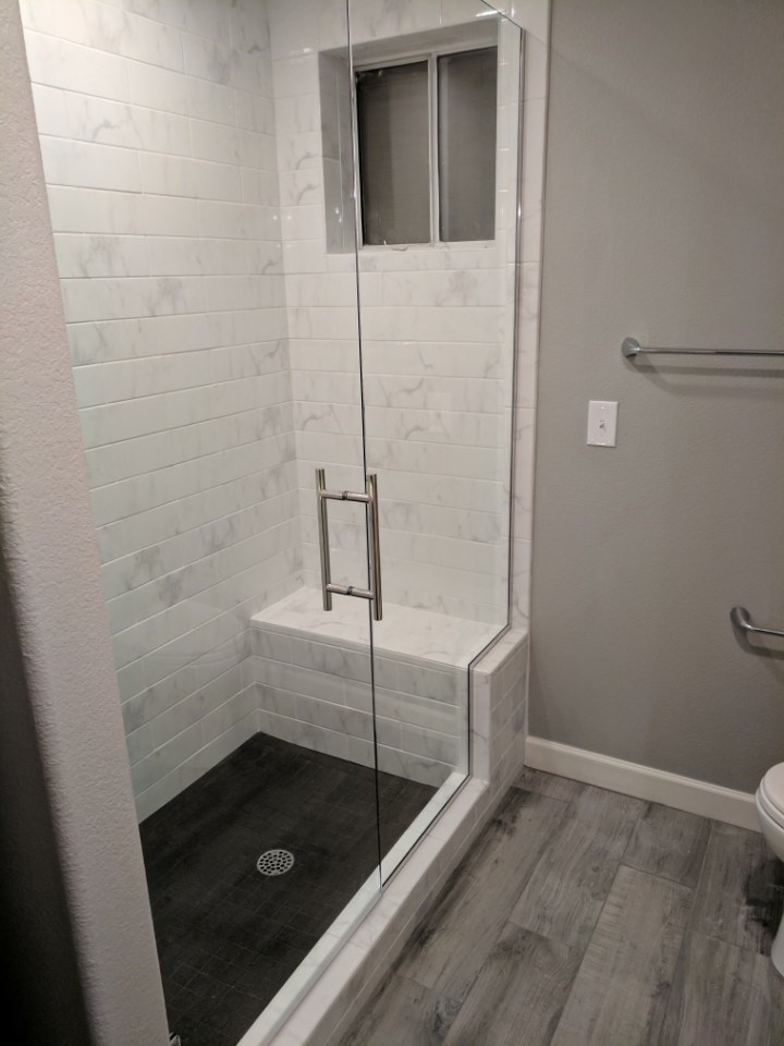 Large modern master bathroom in Phoenix with recessed-panel cabinets, white cabinets, a double shower, white tile, subway tile, grey walls, ceramic floors, an undermount sink, quartzite benchtops and a hinged shower door.