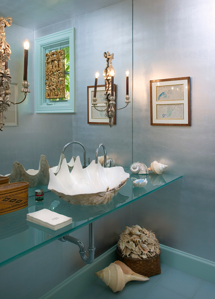 Inspiration for a beach style powder room in Santa Barbara with a vessel sink, glass benchtops and turquoise benchtops.