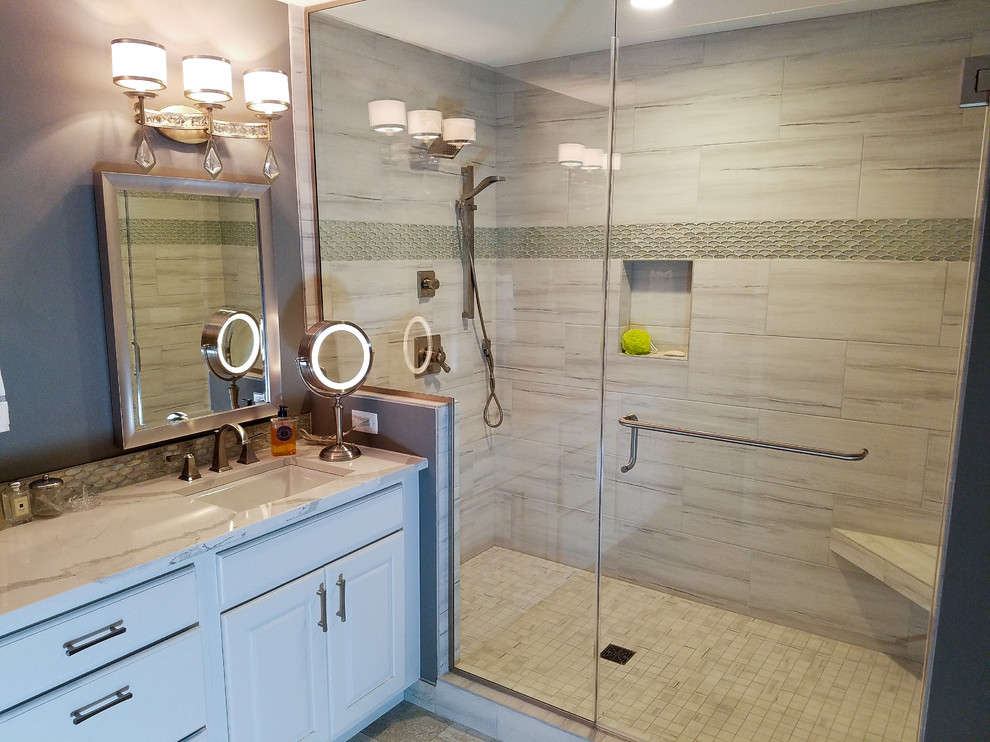 Inspiration for a mid-sized transitional master bathroom in Other with raised-panel cabinets, white cabinets, an alcove shower, a two-piece toilet, gray tile, porcelain tile, grey walls, porcelain floors, an undermount sink and engineered quartz benchtops.