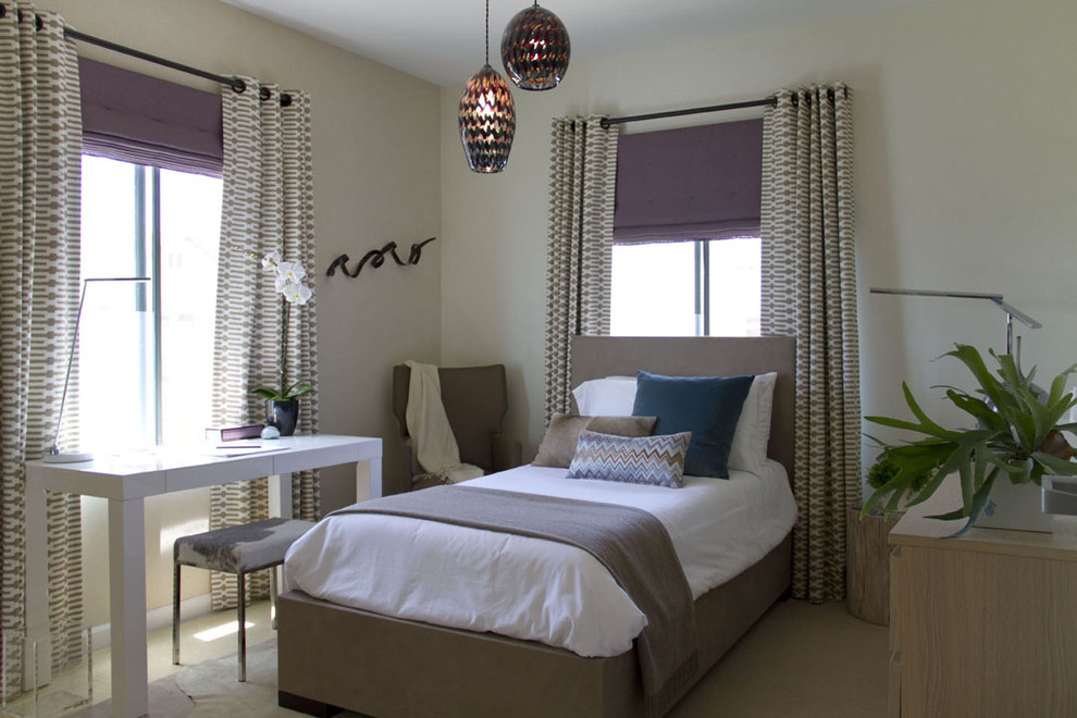 This is an example of a contemporary bedroom in Los Angeles with beige walls.