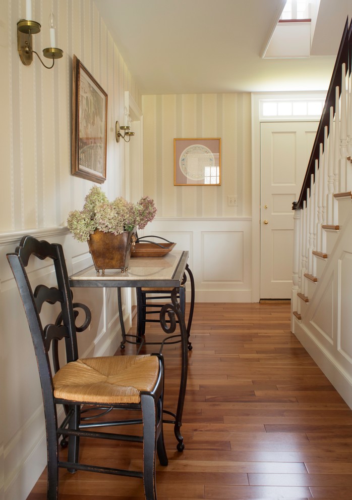 Large transitional wooden straight wood railing staircase photo with painted risers