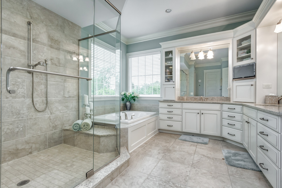 Design ideas for a transitional master bathroom in Columbus with raised-panel cabinets, white cabinets, an alcove tub, blue walls, beige floor, a hinged shower door and beige benchtops.