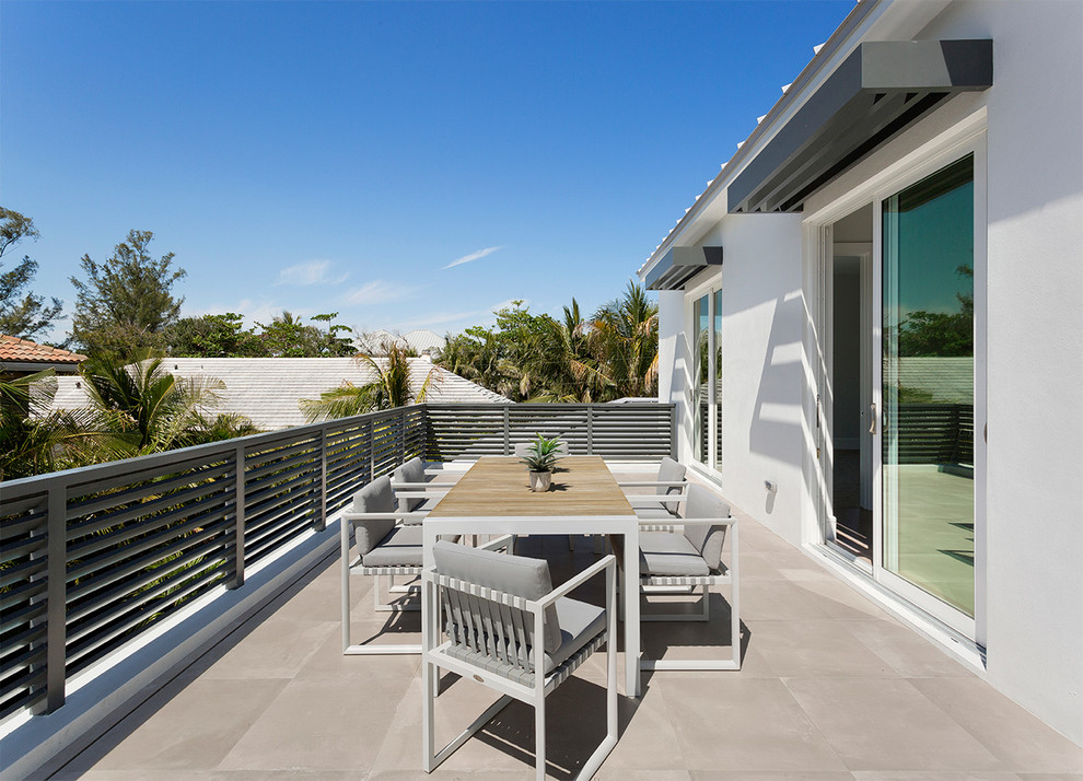 Mid-sized modern balcony in Other with no cover and metal railing.