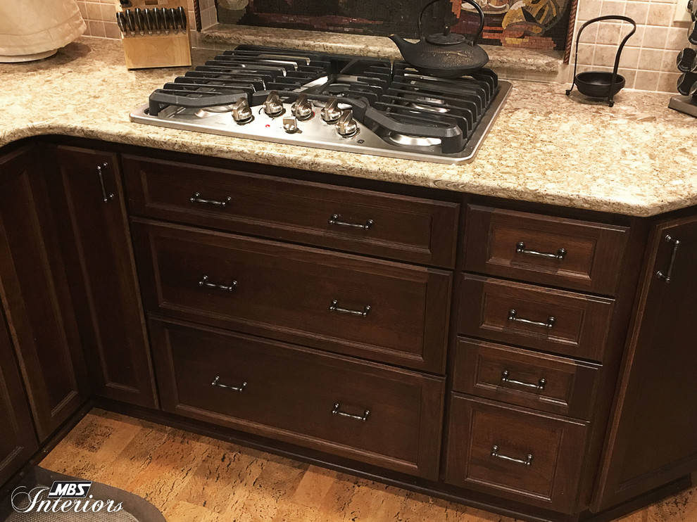 Inspiration for a small transitional u-shaped eat-in kitchen remodel with an undermount sink, recessed-panel cabinets, white cabinets, quartzite countertops, multicolored backsplash, mosaic tile backsplash, stainless steel appliances and no island