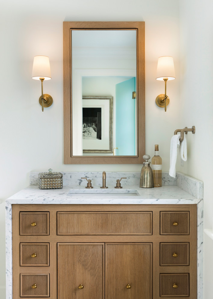 Inspiration for a large traditional master bathroom in Minneapolis with beaded inset cabinets, light wood cabinets, a claw-foot tub, a curbless shower, a two-piece toilet, white tile, marble, white walls, mosaic tile floors, a drop-in sink, marble benchtops, white floor, a hinged shower door and white benchtops.