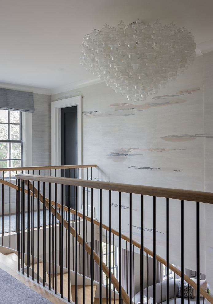 Inspiration for a mid-sized contemporary hallway in Boston with grey walls, light hardwood floors and wallpaper.