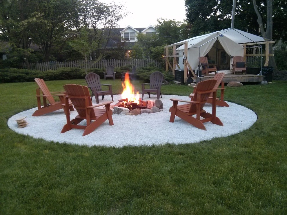Inspiration for a large scandinavian backyard full sun garden in Chicago with a fire feature.