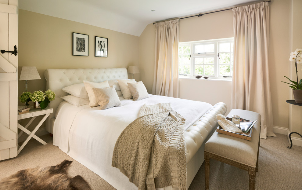 Design ideas for a small traditional master bedroom in Hertfordshire with beige walls, carpet, no fireplace and beige floor.