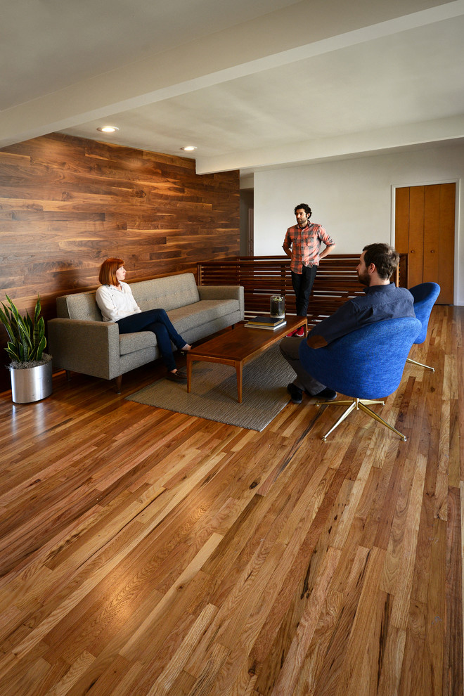 Modern living room in Salt Lake City with dark hardwood floors.