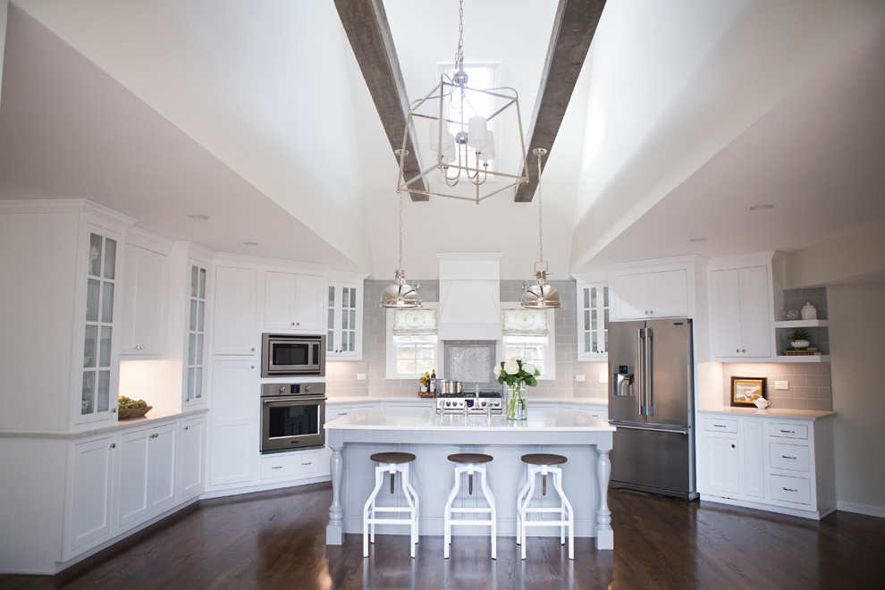 Transitional kitchen photo with an island