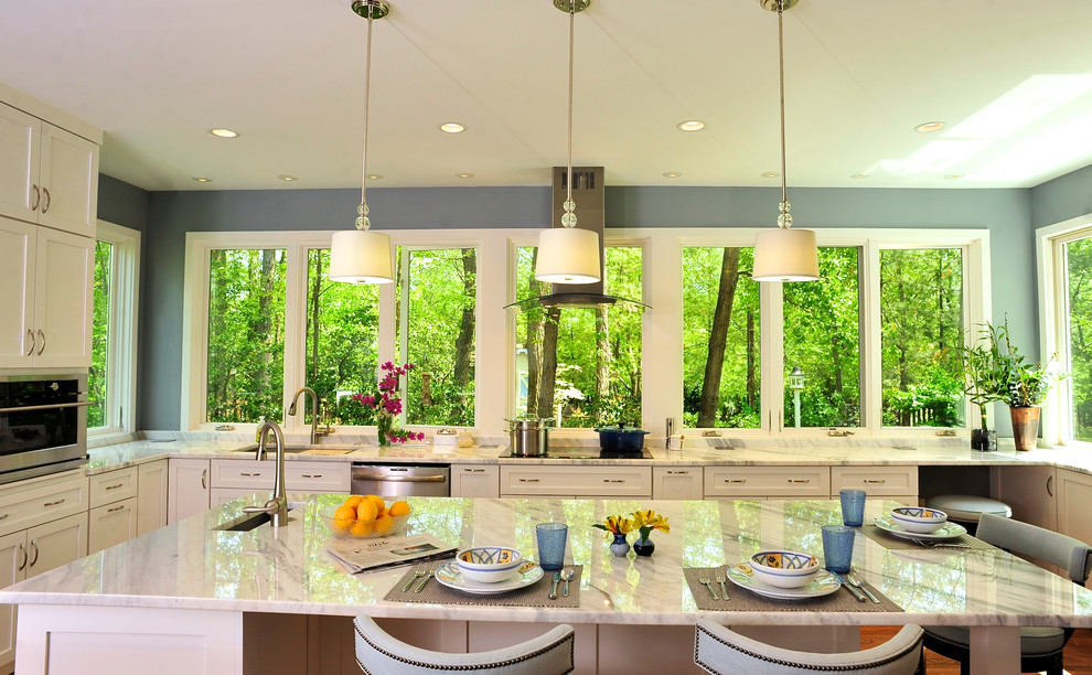 Large transitional u-shaped medium tone wood floor kitchen photo in DC Metro with an undermount sink, shaker cabinets, white cabinets, granite countertops, stainless steel appliances and an island