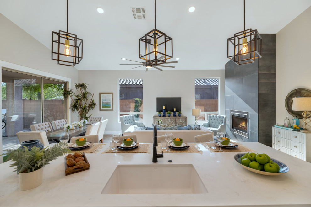 Kitchen - transitional vinyl floor and brown floor kitchen idea in Phoenix with shaker cabinets, dark wood cabinets, quartz countertops, an island and white countertops