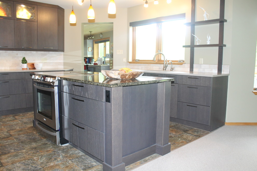 Photo of a large contemporary l-shaped eat-in kitchen with an undermount sink, flat-panel cabinets, grey cabinets, limestone benchtops, beige splashback, stone tile splashback, stainless steel appliances, slate floors, with island, beige floor and green benchtop.