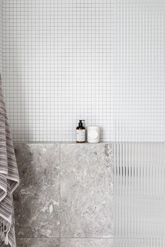 Inspiration for a mid-sized contemporary bathroom in Melbourne with an open shower, subway tile and terrazzo floors.