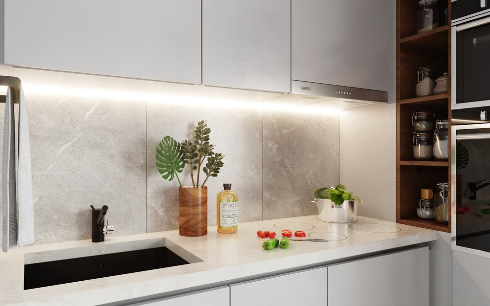 Для кухонного фартука выбрана фактура серого мрамора. Индукционная варочная пове