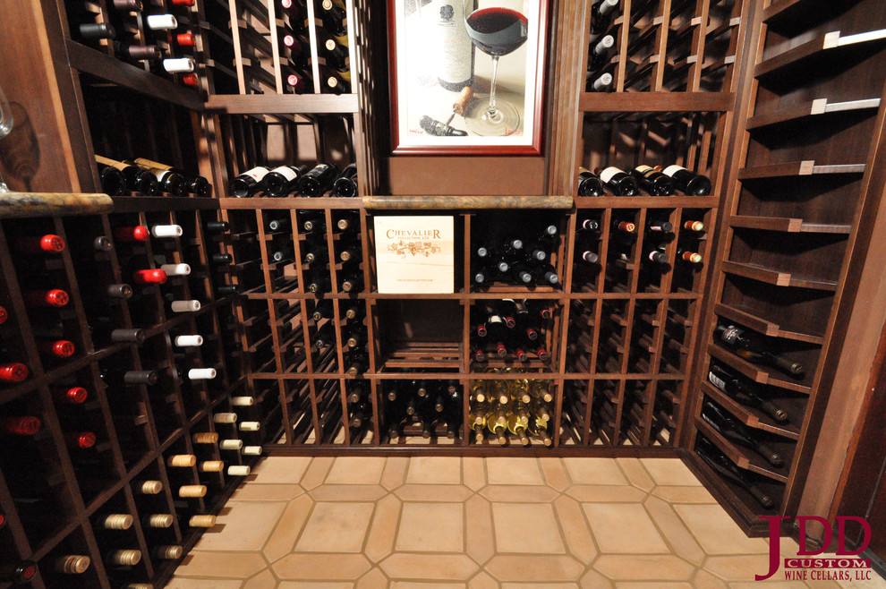 Mid-sized midcentury wine cellar in San Diego with porcelain floors and display racks.