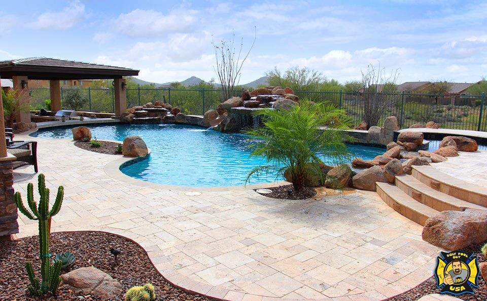 Hot tub - large transitional backyard stone and custom-shaped natural hot tub idea in Phoenix