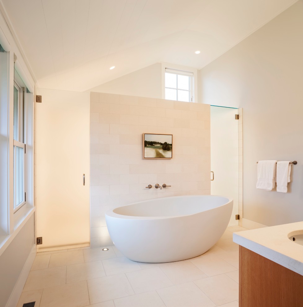 Beach style bathroom in Providence with a freestanding tub, a curbless shower and white tile.