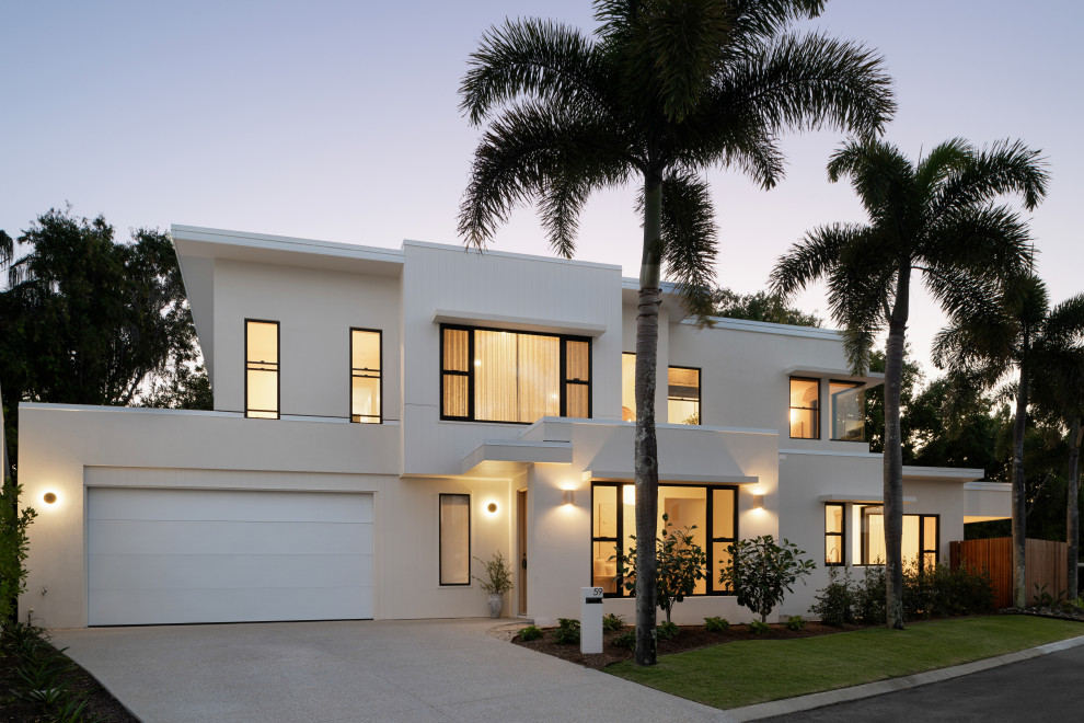 Inspiration for a large contemporary two-storey beige house exterior in Sunshine Coast with concrete fiberboard siding.