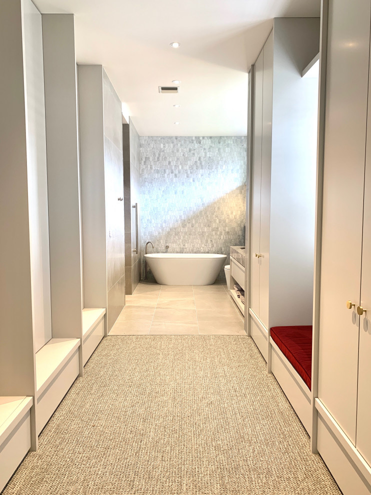 Design ideas for a large traditional gender-neutral walk-in wardrobe in Melbourne with shaker cabinets, grey cabinets, carpet and grey floor.