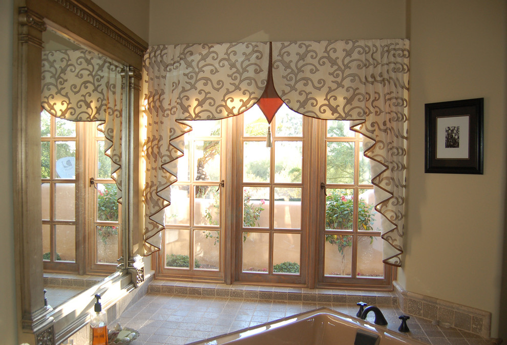 Mid-sized transitional master beige tile and stone tile ceramic tile doorless shower photo in Phoenix with raised-panel cabinets, dark wood cabinets, a hot tub, a one-piece toilet, beige walls and a drop-in sink