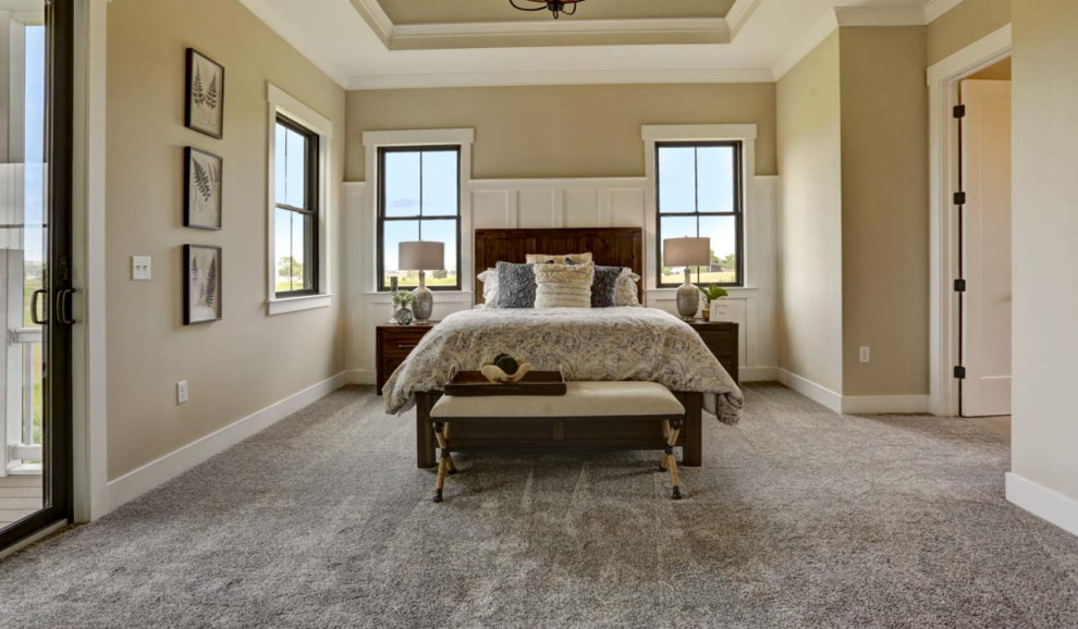 This is an example of a large arts and crafts master bedroom in Other with beige walls, carpet, beige floor, recessed and decorative wall panelling.
