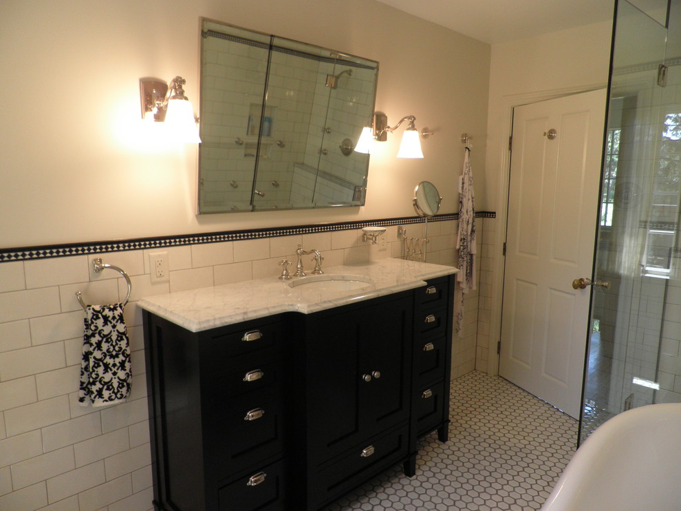 Design ideas for a mid-sized traditional master bathroom in Minneapolis with a pedestal sink, marble benchtops, a claw-foot tub, a corner shower, a one-piece toilet, white tile, ceramic tile, white walls, black cabinets, ceramic floors, white floor and a hinged shower door.