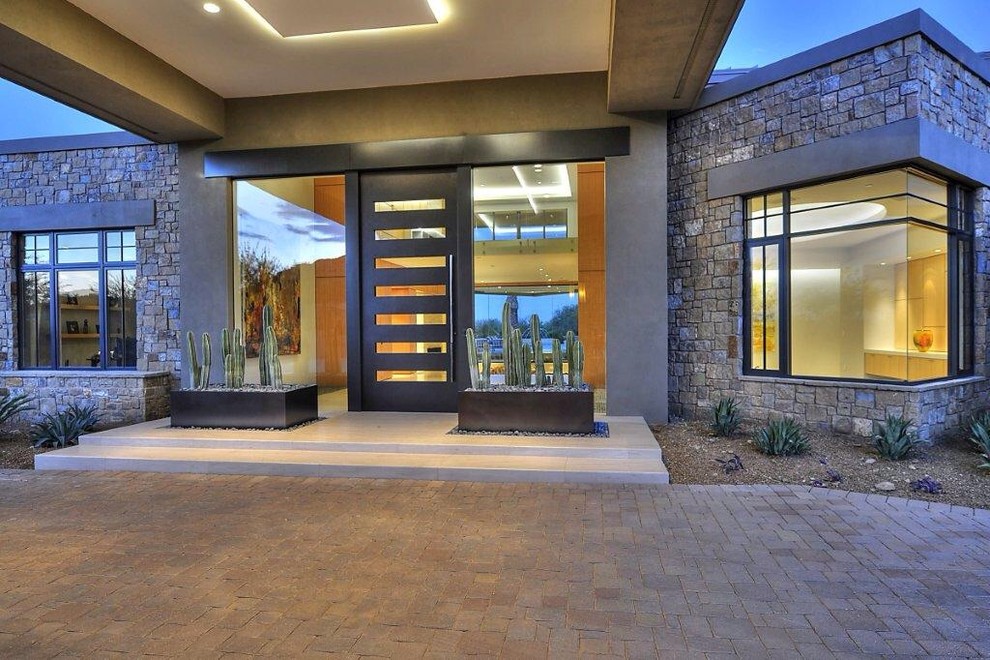 Inspiration for a mid-sized modern front door in Phoenix with a single front door and a metal front door.