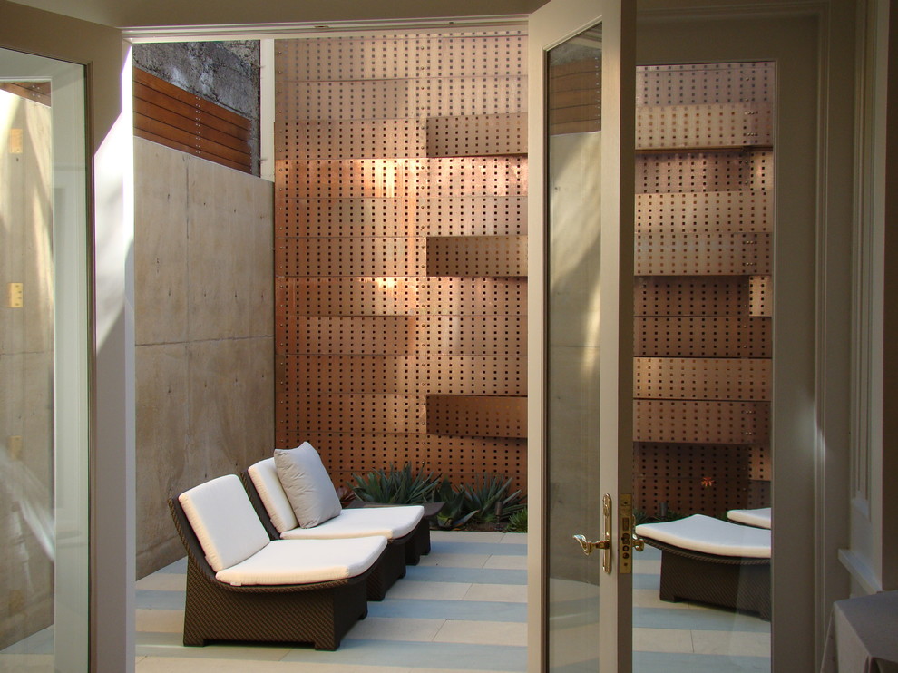 This is an example of a small contemporary courtyard patio in San Francisco with no cover.