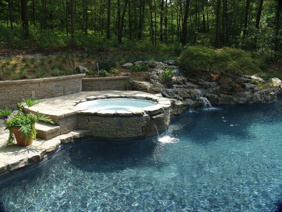 Photo of a traditional pool in New York with a hot tub.