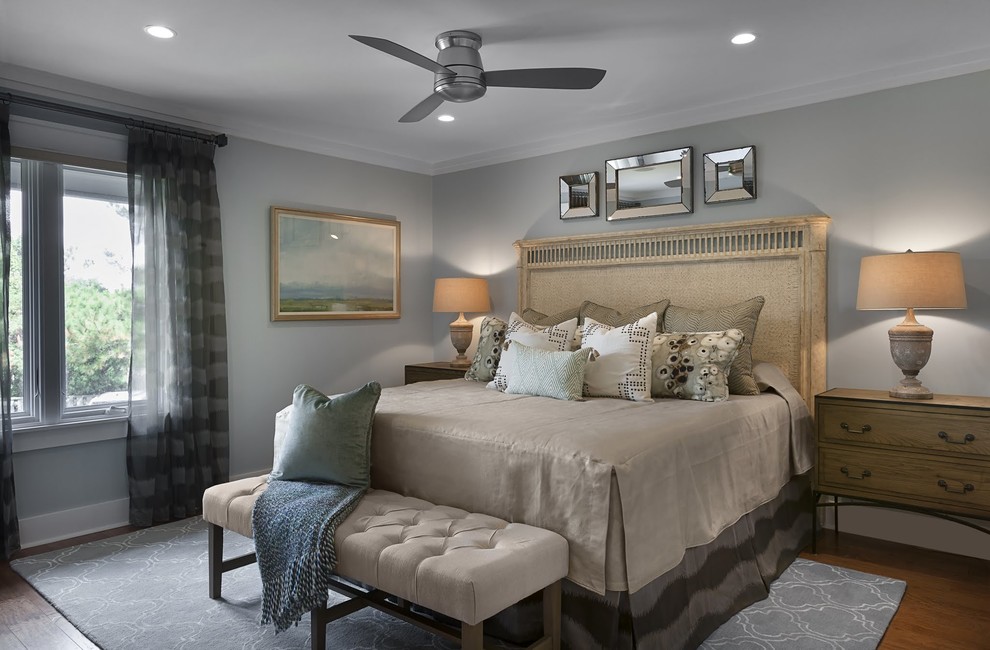 Design ideas for a large contemporary master bedroom in Charleston with grey walls, medium hardwood floors and no fireplace.
