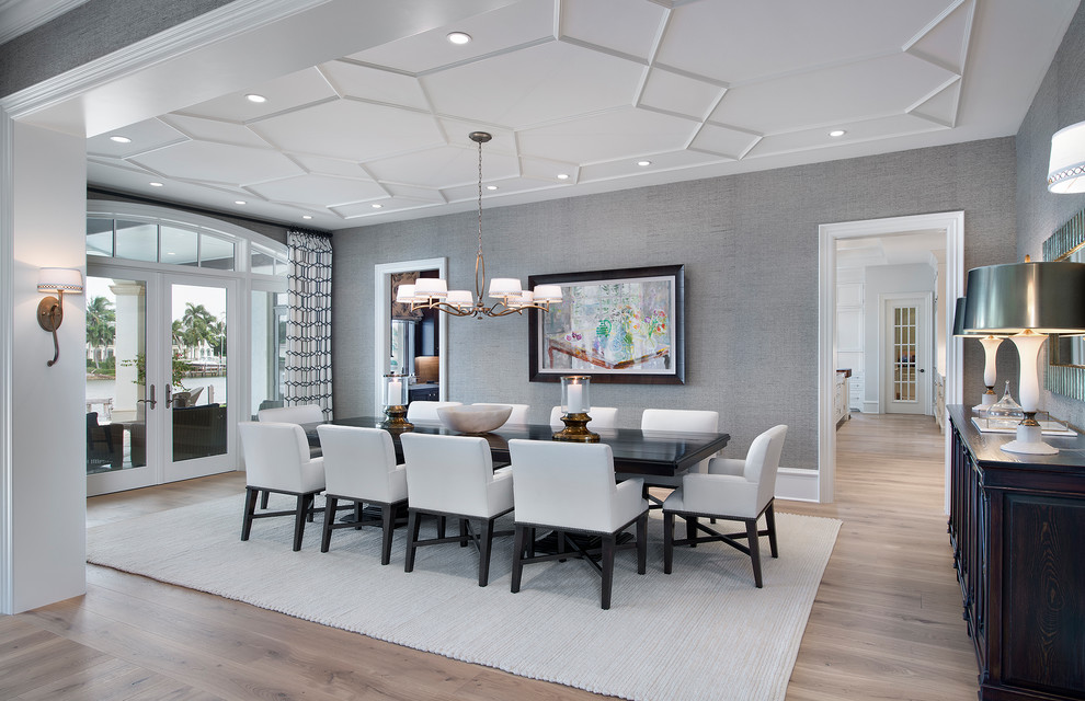 Beach style separate dining room in Cleveland with grey walls and light hardwood floors.