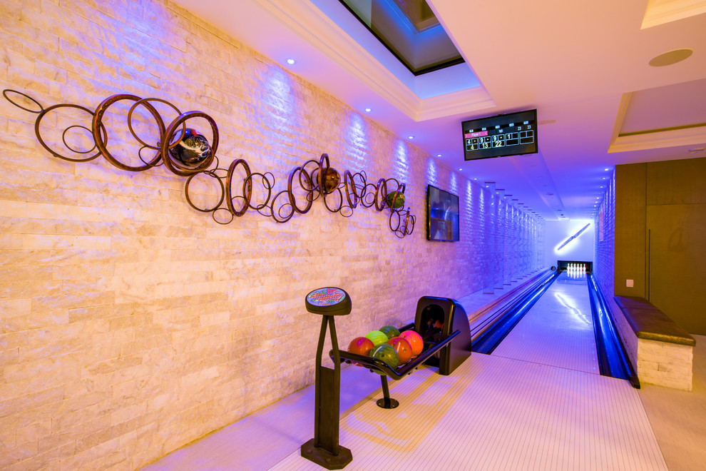 Mid-sized transitional home gym in Buckinghamshire with white floor and white walls.