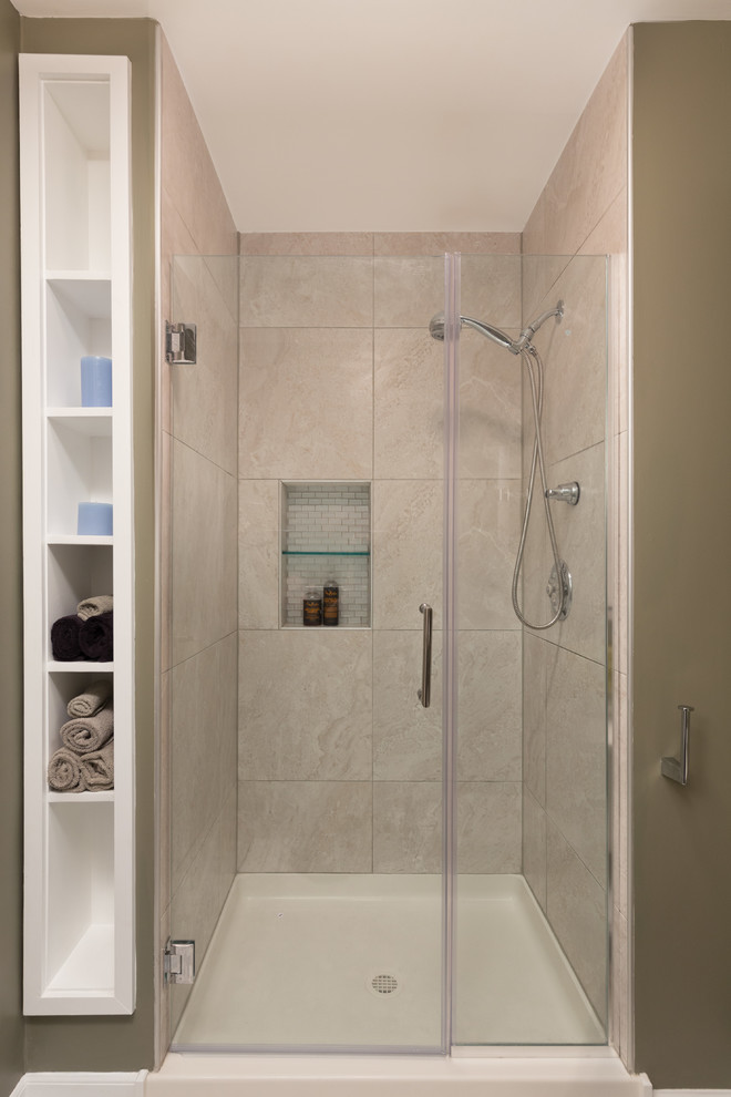 Photo of a mid-sized transitional 3/4 bathroom in Chicago with flat-panel cabinets, medium wood cabinets, an alcove shower, a two-piece toilet, gray tile, stone tile, beige walls, an integrated sink, marble benchtops and mosaic tile floors.