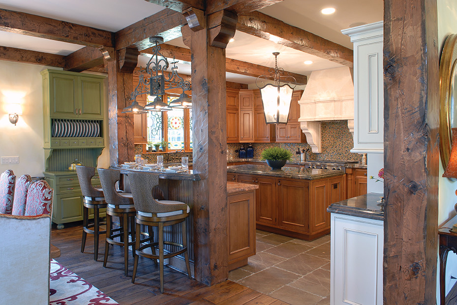 Example of a large french country u-shaped exposed beam eat-in kitchen design in Chicago with an undermount sink, recessed-panel cabinets, medium tone wood cabinets, granite countertops, multicolored backsplash, mosaic tile backsplash, stainless steel appliances, an island and multicolored countertops