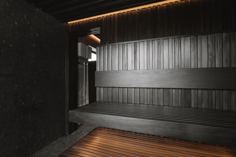 Сауна из тонированной липы со скрытой печью.